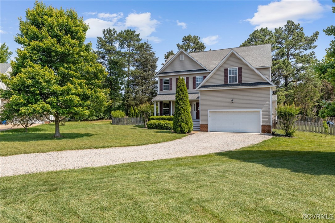 14300 Wallingham Loop Midlothian, VA 23114 - Photo 6 of 50 a front view of a house with a yard and garage