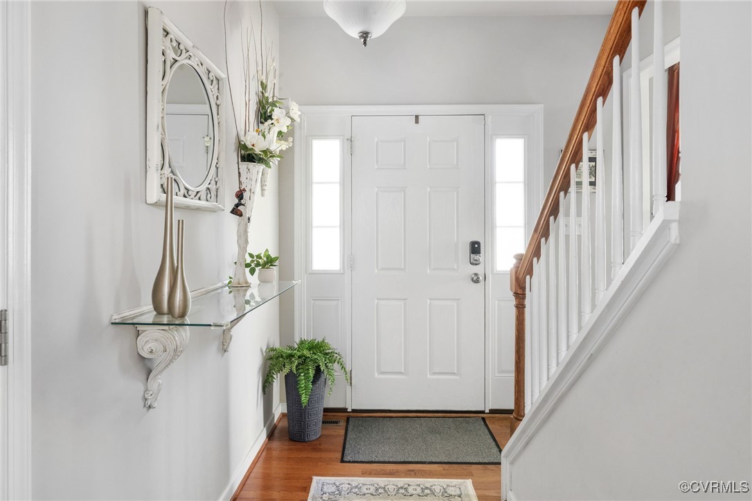 14300 Wallingham Loop Midlothian, VA 23114 - Photo 10 of 50 a view of a hallway with wooden floor and stairs
