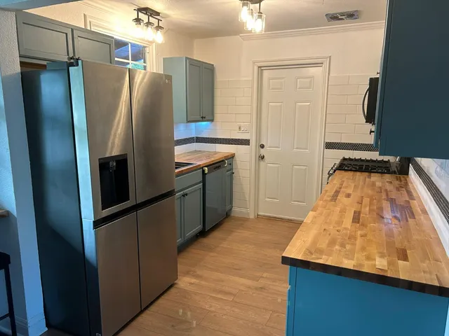 a bedroom with a bed and a potted plant