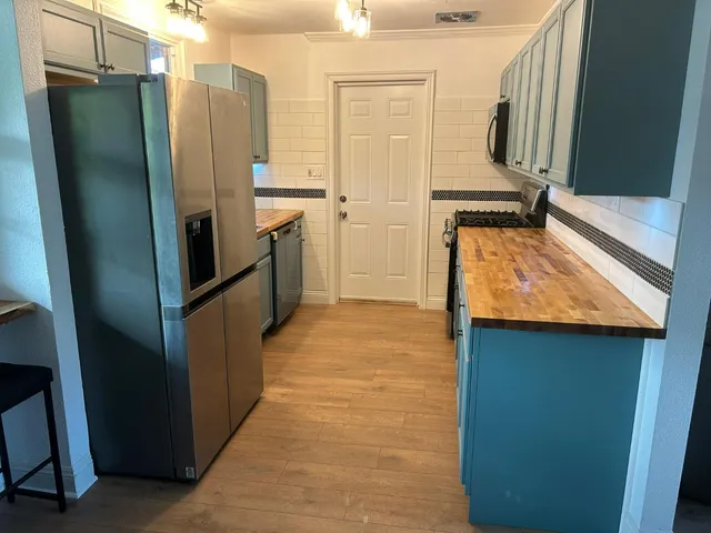 an empty room with wooden floor