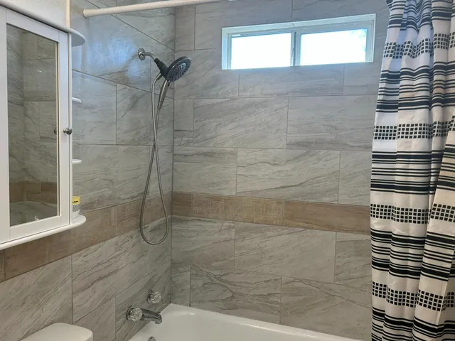 a kitchen with stainless steel appliances a sink and a microwave