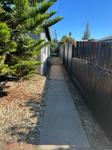 a view of a backyard with sitting area
