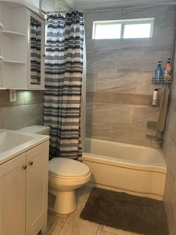 a view of living room with furniture and a flat screen tv