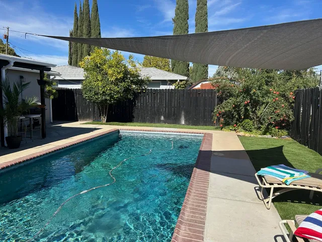 a living room with furniture window and wooden floor