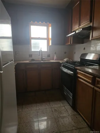 a room with wooden floor and windows
