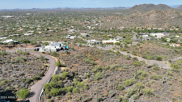 an aerial view of residential house and green space