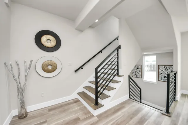 a view of living room with furniture and wooden floor