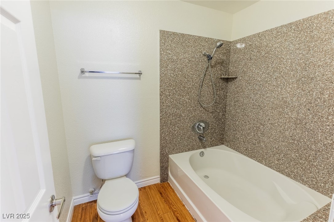 2451 North Rainbow Boulevard, Unit 1116 Las Vegas, NV 89108 - Photo 17 of 28 Full bathroom featuring wood finished floors and shower / bath combination
