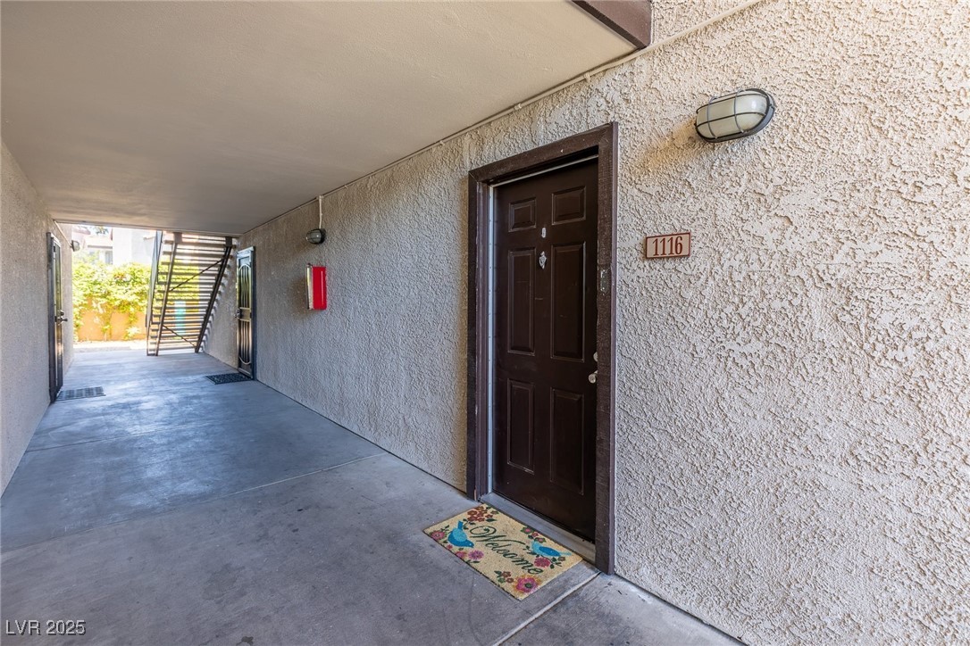 2451 North Rainbow Boulevard, Unit 1116 Las Vegas, NV 89108 - Photo 2 of 28 View of exterior entry with stucco siding