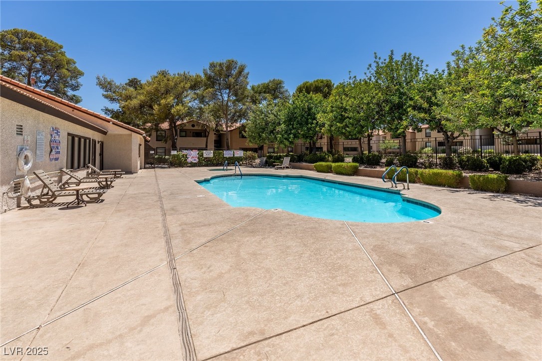 2451 North Rainbow Boulevard, Unit 1116 Las Vegas, NV 89108 - Photo 23 of 28 Community pool with a patio