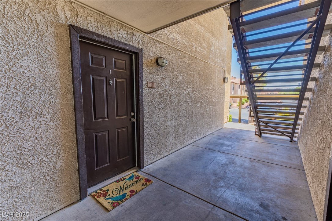 2451 North Rainbow Boulevard, Unit 1116 Las Vegas, NV 89108 - Photo 27 of 28 View of exterior entry featuring stucco siding
