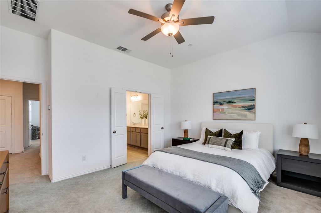 3718 Pelican Rst Way Arlington, TX 76005 - Photo 13 of 37 a bedroom with a bed and a chandelier