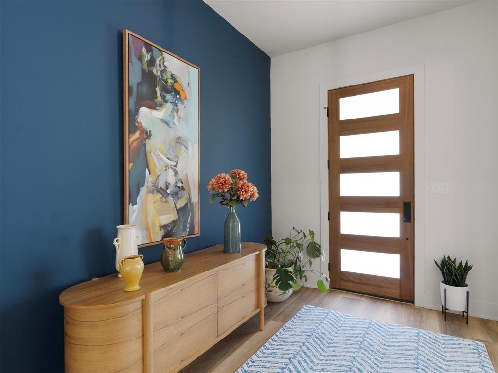 800 John Dean Road Gilmer, TX 75644 - Photo 11 of 40 a room with painting on the wall and a window