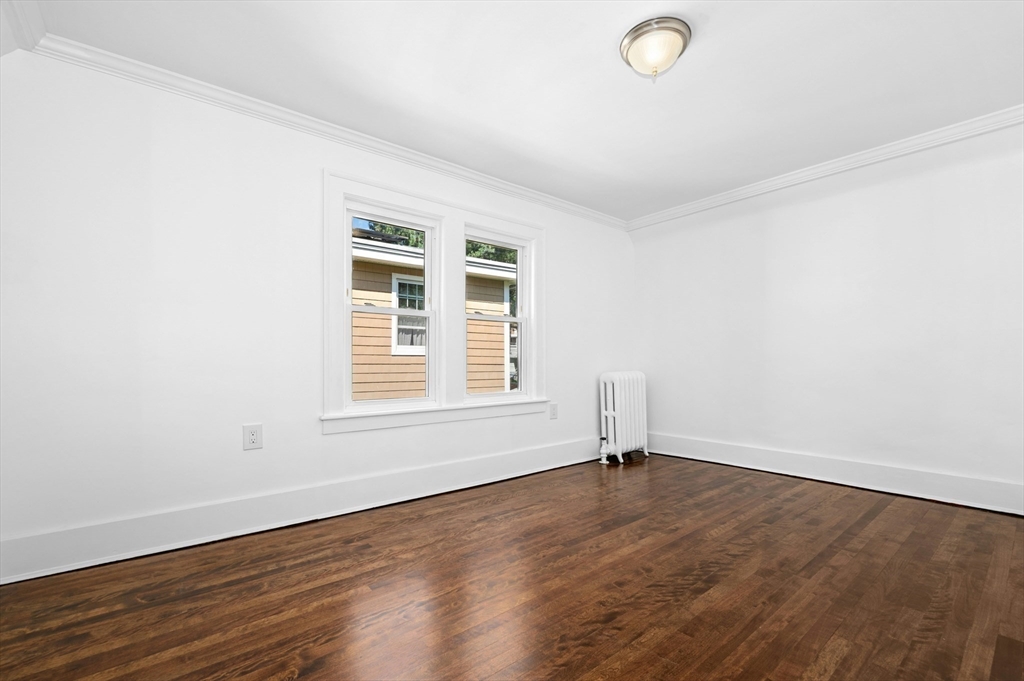 5 Coombs Road Worcester, MA 01602 - Photo 26 of 38 an empty room with wooden floor and windows