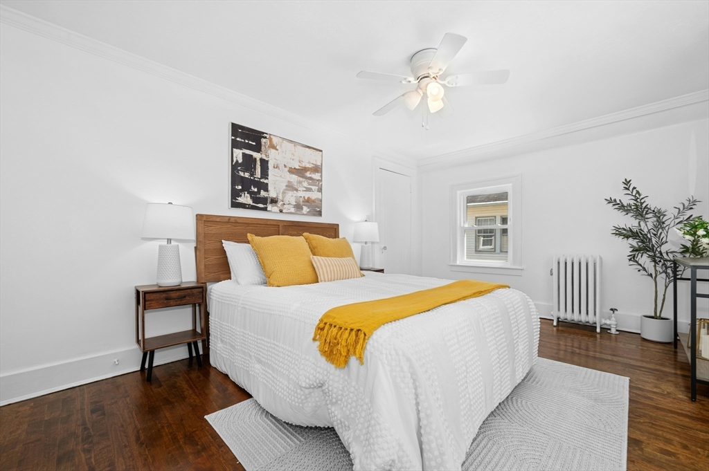 5 Coombs Road Worcester, MA 01602 - Photo 3 of 38 a bedroom with a bed and a chandelier