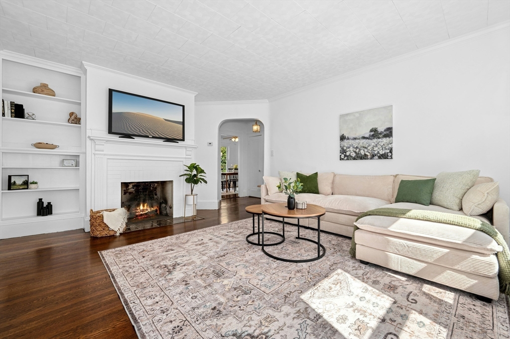 5 Coombs Road Worcester, MA 01602 - Photo 7 of 38 a living room with furniture a flat screen tv and a fireplace