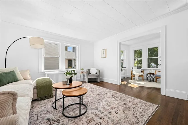 a living room with furniture and a rug