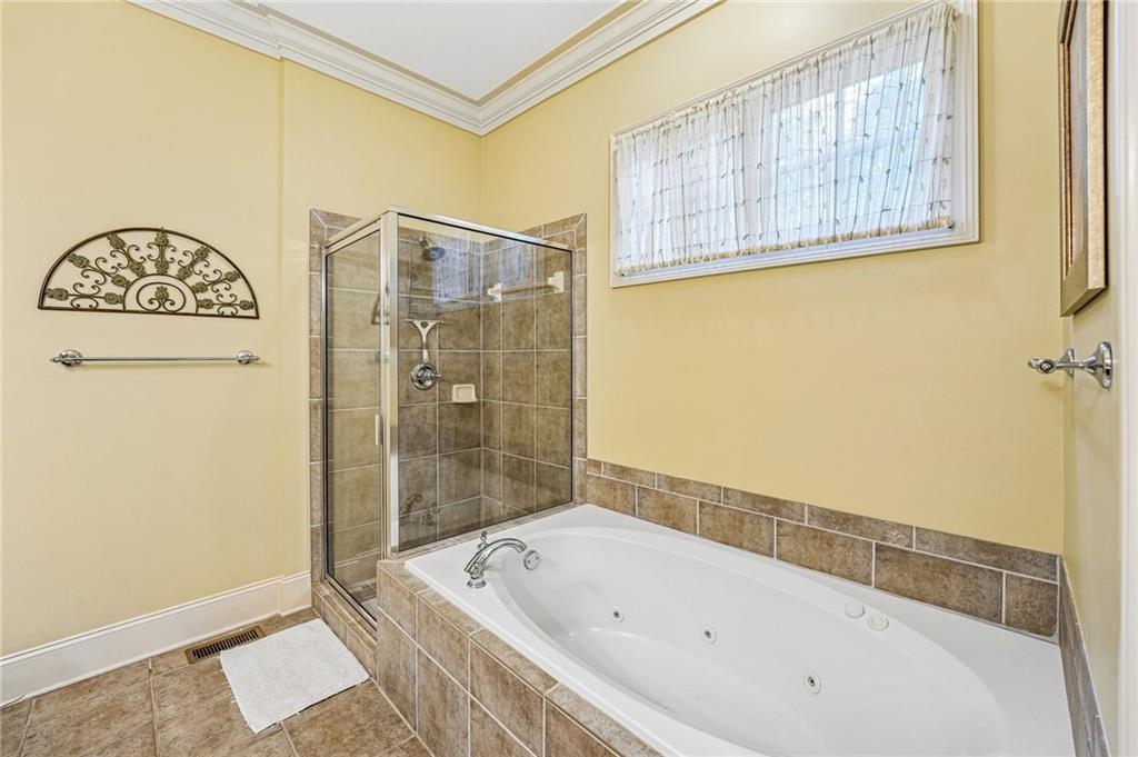 14 Laurel Ridge Lane Big Canoe, GA 30143 - Photo 29 of 72 a bathroom with a bathtub and a shower