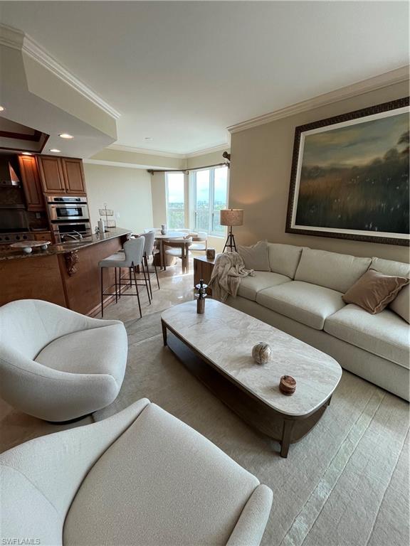 285 Grande Way, Unit 701 Naples, FL 34110 - Photo 11 of 20 a living room with furniture and a couch