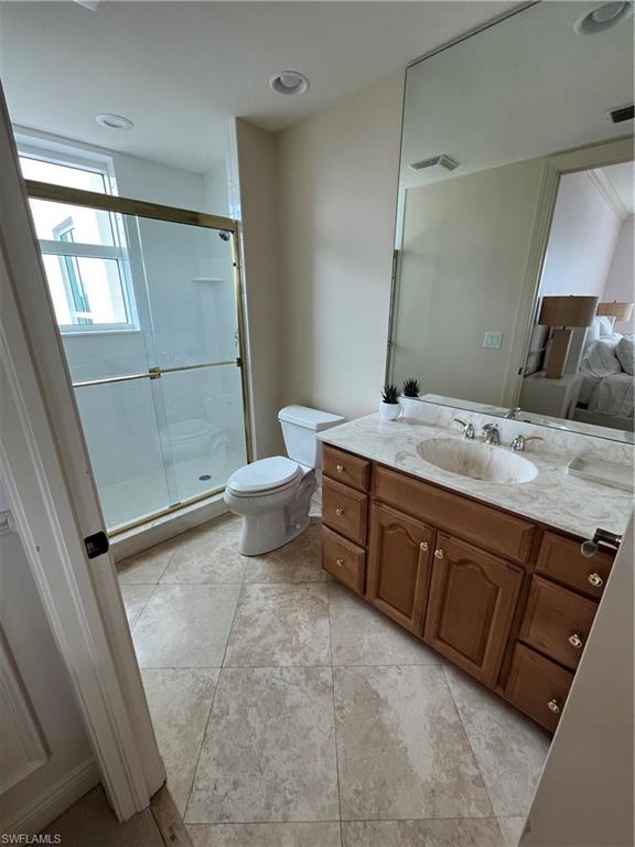 285 Grande Way, Unit 701 Naples, FL 34110 - Photo 20 of 20 a spacious bathroom with a granite countertop sink toilet and shower