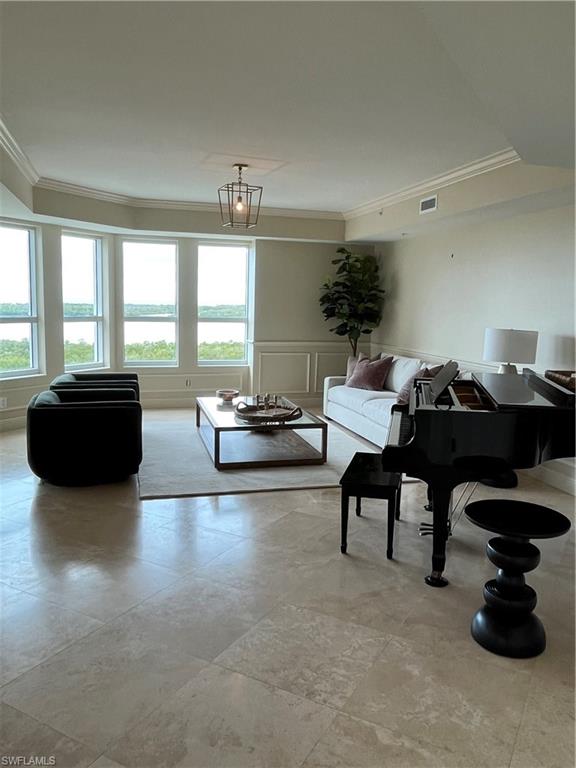 285 Grande Way, Unit 701 Naples, FL 34110 - Photo 2 of 20 a living room with furniture and a large window
