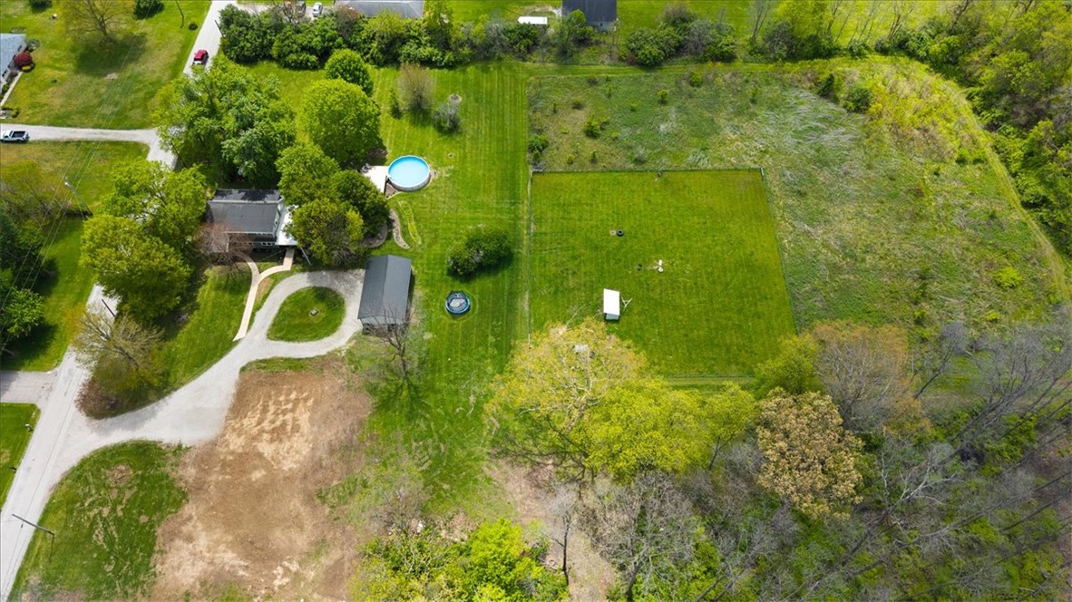 5120 Wheelock Road Troy, OH 45373 - Photo 60 of 67 Expansive green estate with diverse landscape and charming structures.