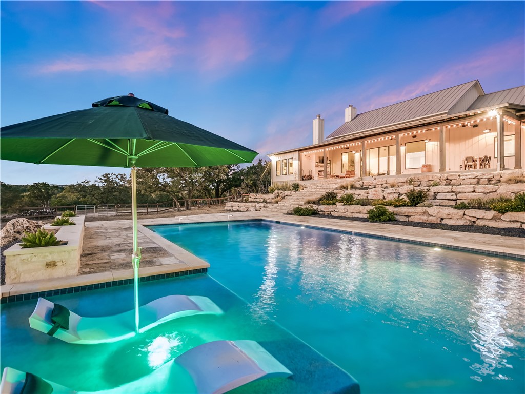570 Toro Pass Wimberley, TX 78676 - Photo 1 of 1 a view of a swimming pool with a lounge chairs