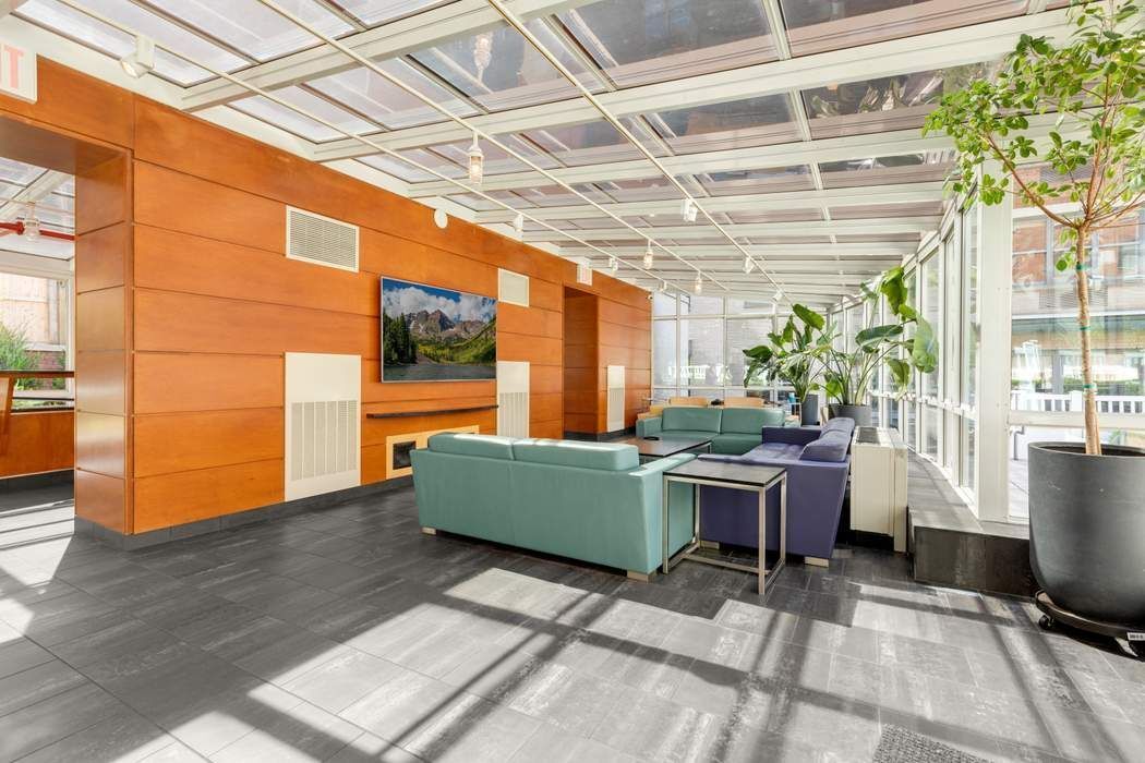 516 West 47th Street, Unit N6A Manhattan, NY 10036 - Photo 10 of 16 a view of a room with furniture and a potted plant