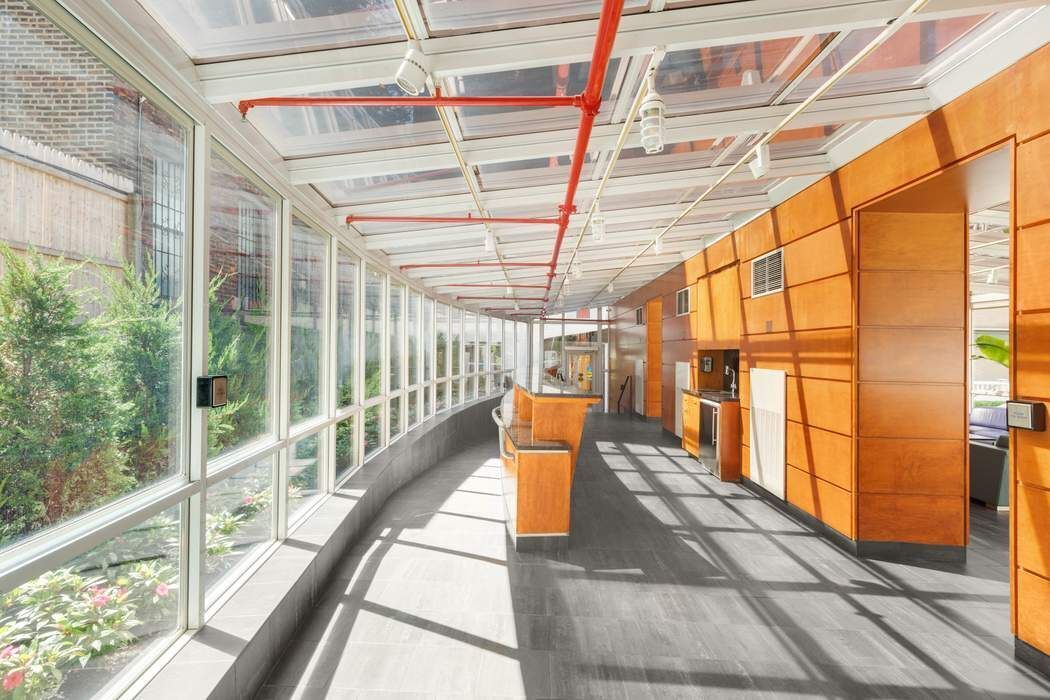 516 West 47th Street, Unit N6A Manhattan, NY 10036 - Photo 11 of 16 a view of a porch with wooden floor and windows