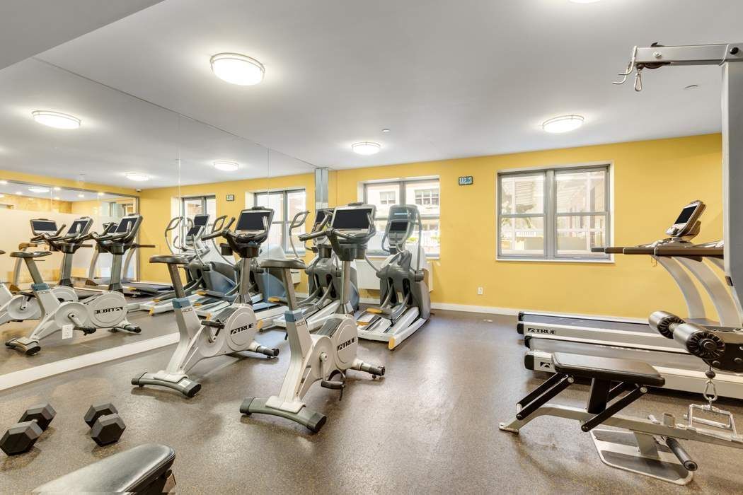 516 West 47th Street, Unit N6A Manhattan, NY 10036 - Photo 12 of 16 a room with gym equipment and a large window