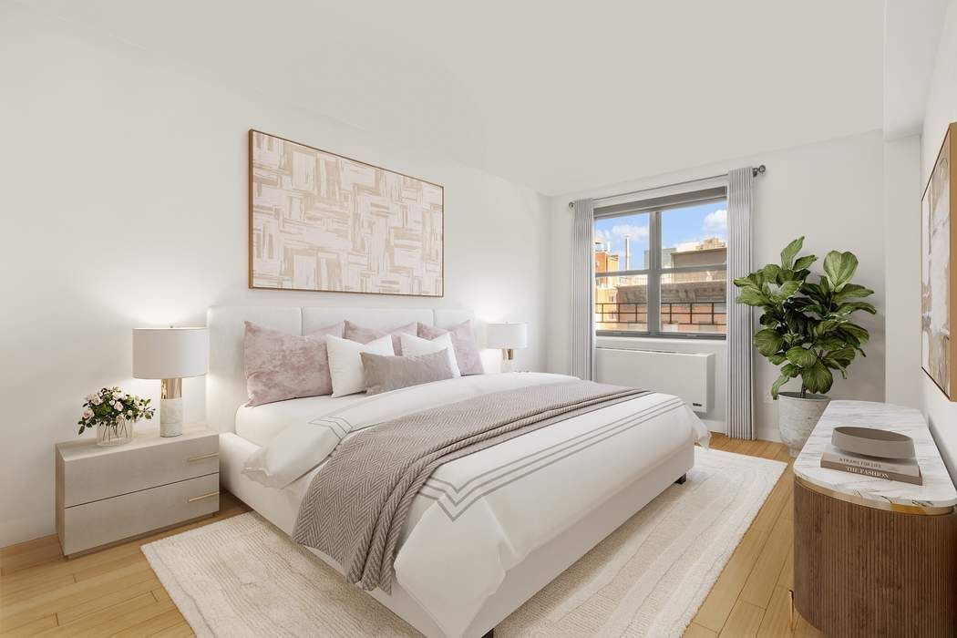 516 West 47th Street, Unit N6A Manhattan, NY 10036 - Photo 4 of 16 a spacious bedroom with a bed and a couch