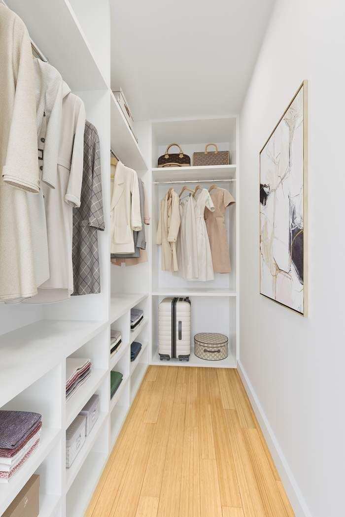 516 West 47th Street, Unit N6A Manhattan, NY 10036 - Photo 5 of 16 a view of walk in closet with clothes and shoes