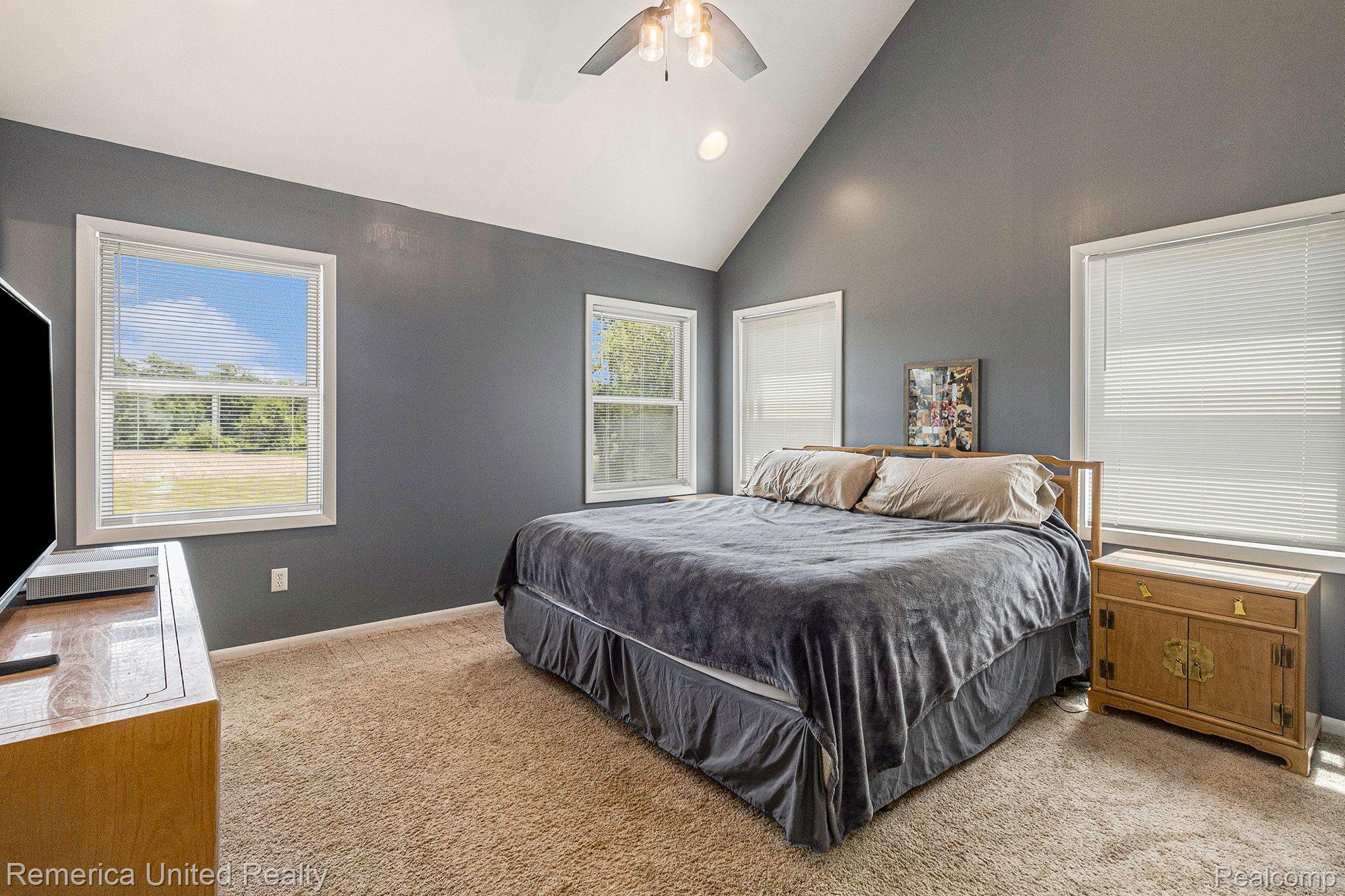 8722 North Gregory Road Fowlerville, MI 48836 - Photo 19 of 35 Vaulted 1st Floor Primary Bedroom