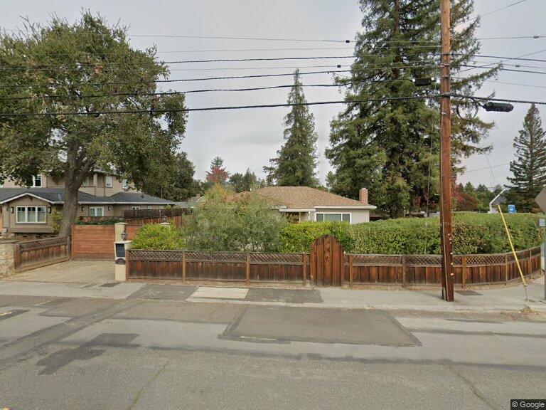 a view of a yard and front view of a house
