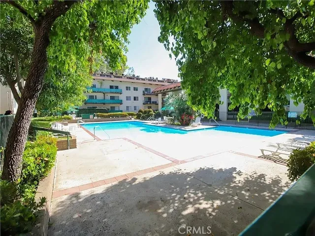 a view of a swimming pool with a patio
