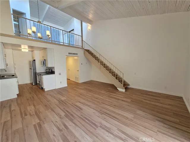 a view of a living room with hardwood floor