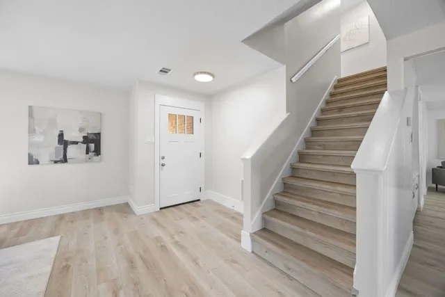 a view of entryway with wooden floor