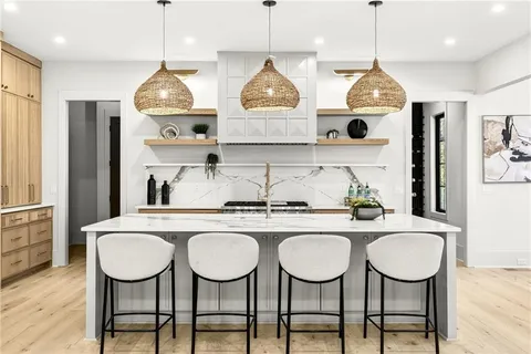 a kitchen with a stove and a microwave