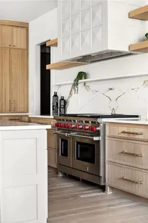 a kitchen with a stove and a microwave