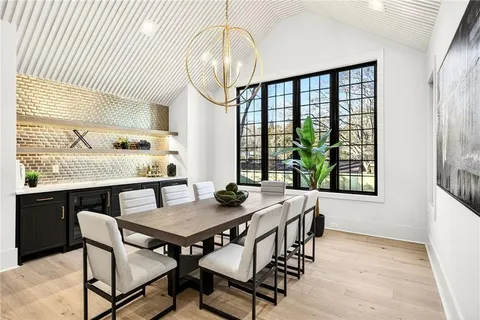 a bathroom with a granite countertop toilet a sink and a mirror