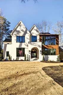 a living room with fireplace furniture and a window