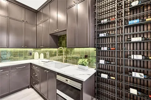 a kitchen with a sink and cabinets