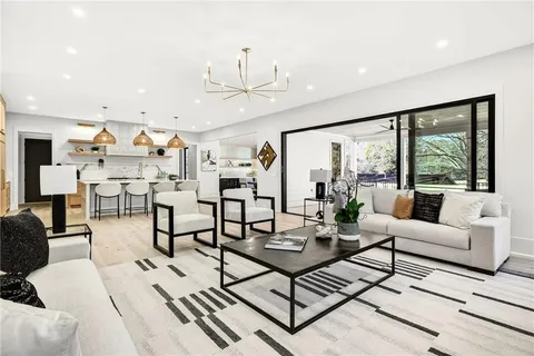 a kitchen with lots of counter top space and wooden floor