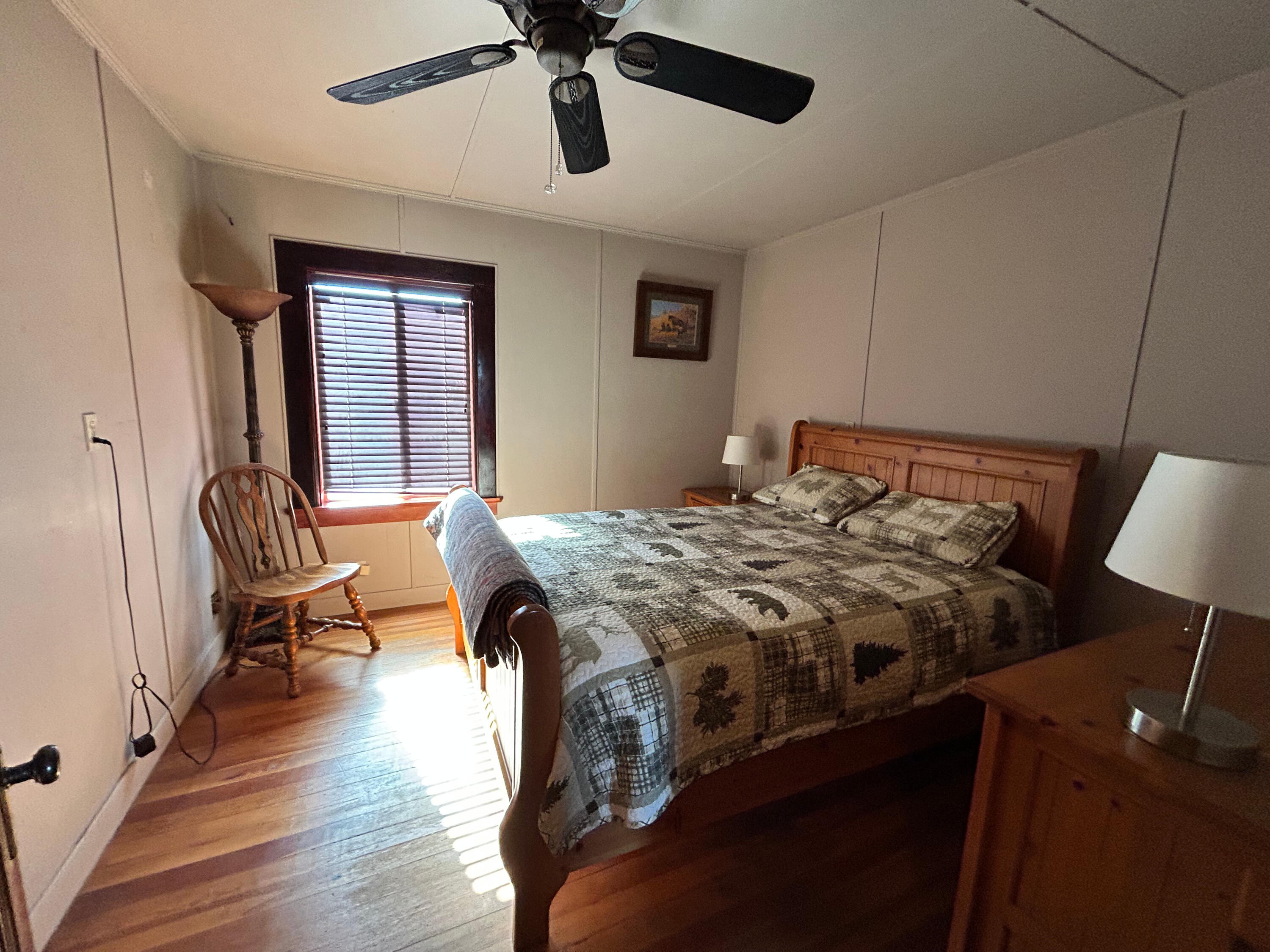 553-185 Punkin Center Road Bieber, CA 96009 - Photo 51 of 57 a bedroom with a bed mirror and window