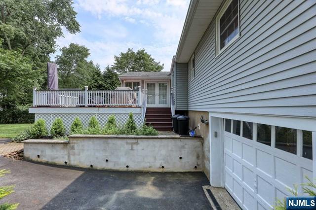 230 Pinelynn Road Glen Rock, NJ 07452 - Photo 16 of 19 a view of a house with a wooden fence
