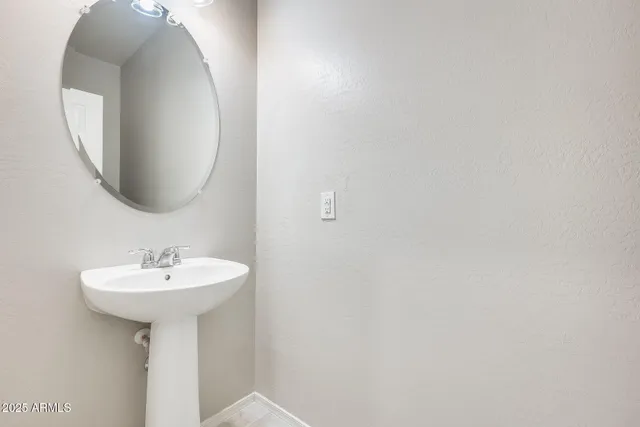 a kitchen with a sink stove and refrigerator