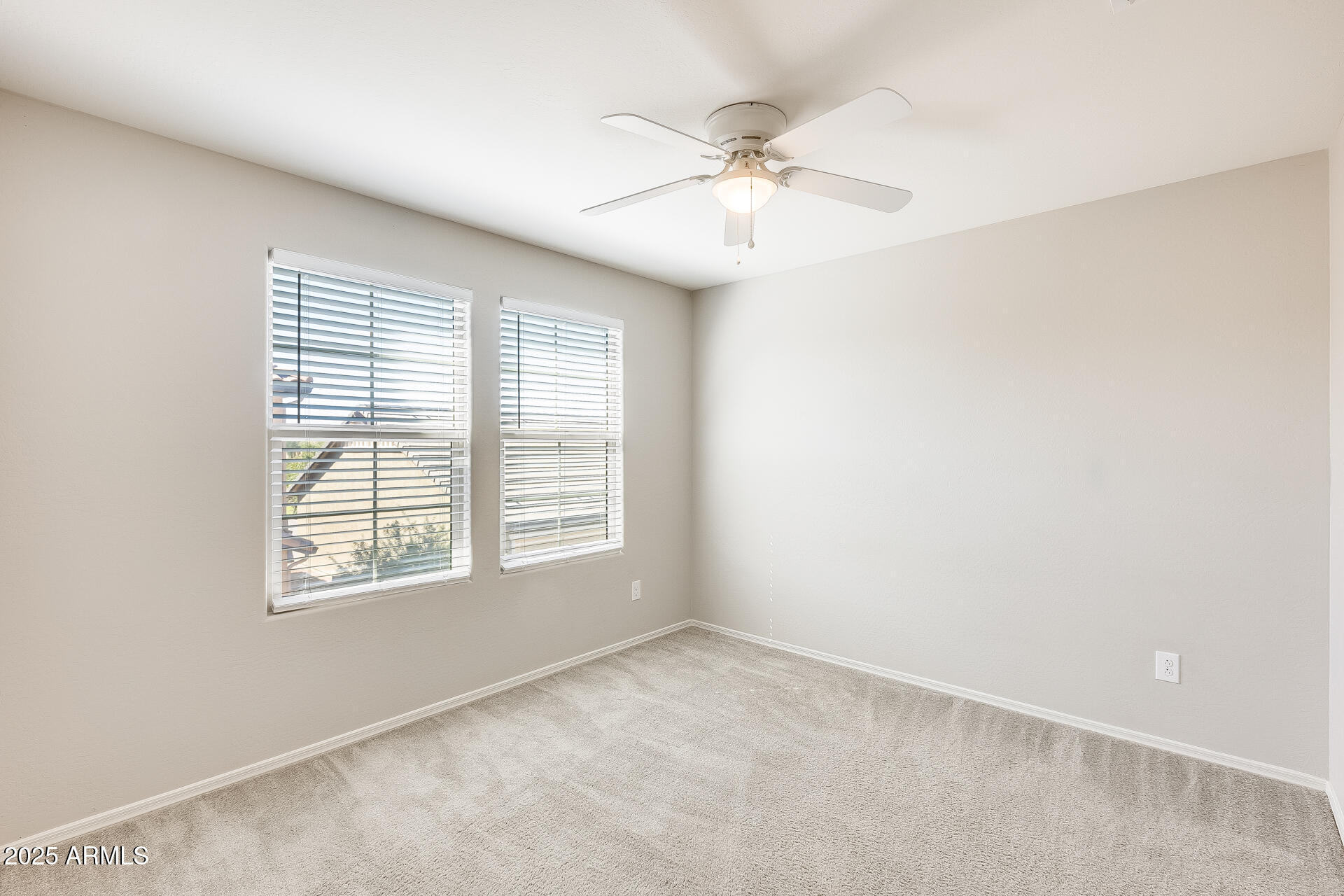 1132 South Amulet Mesa, AZ 85208 - Photo 17 of 37 an empty room with windows and fan