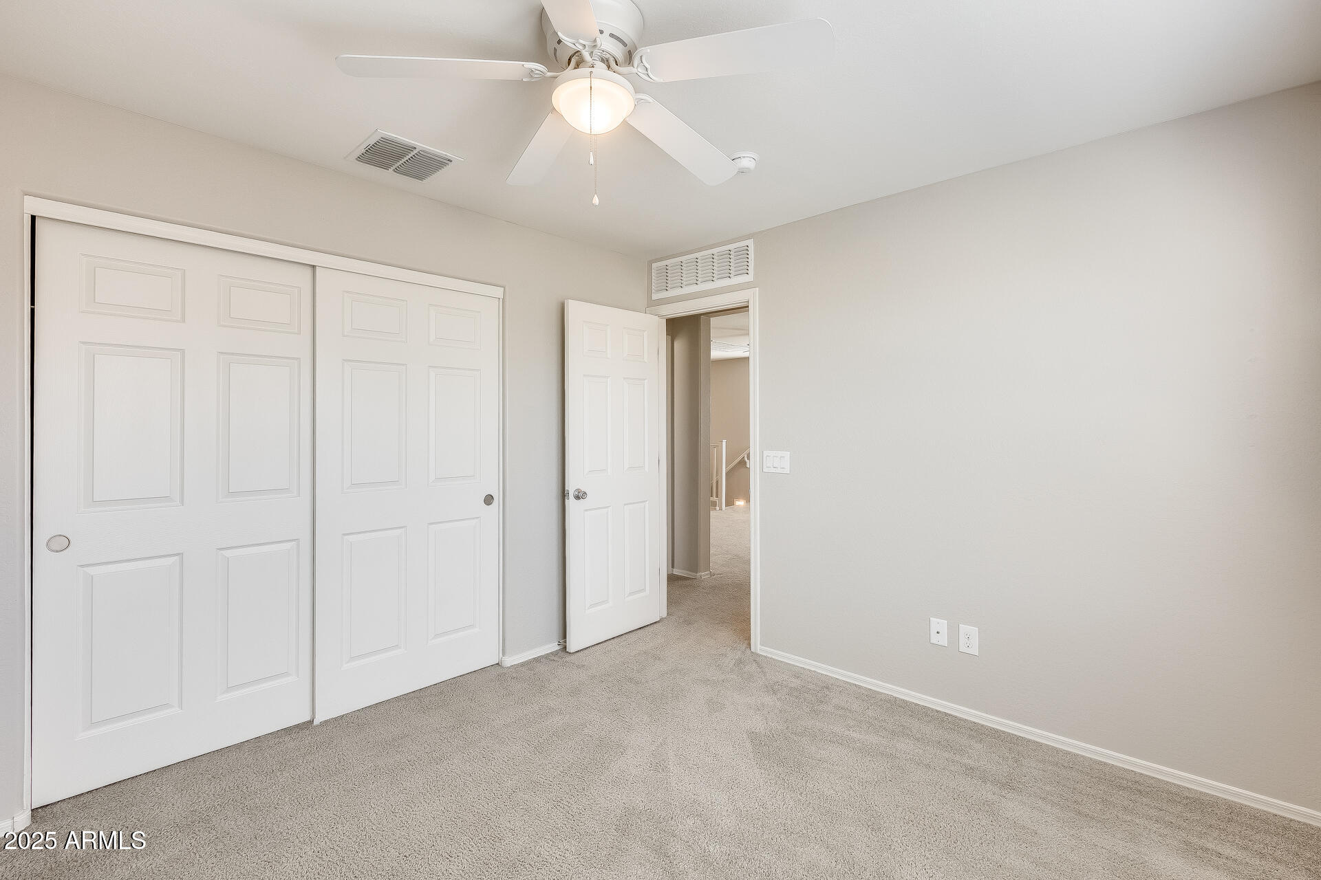 1132 South Amulet Mesa, AZ 85208 - Photo 18 of 37 an empty room with a ceiling fan and a window