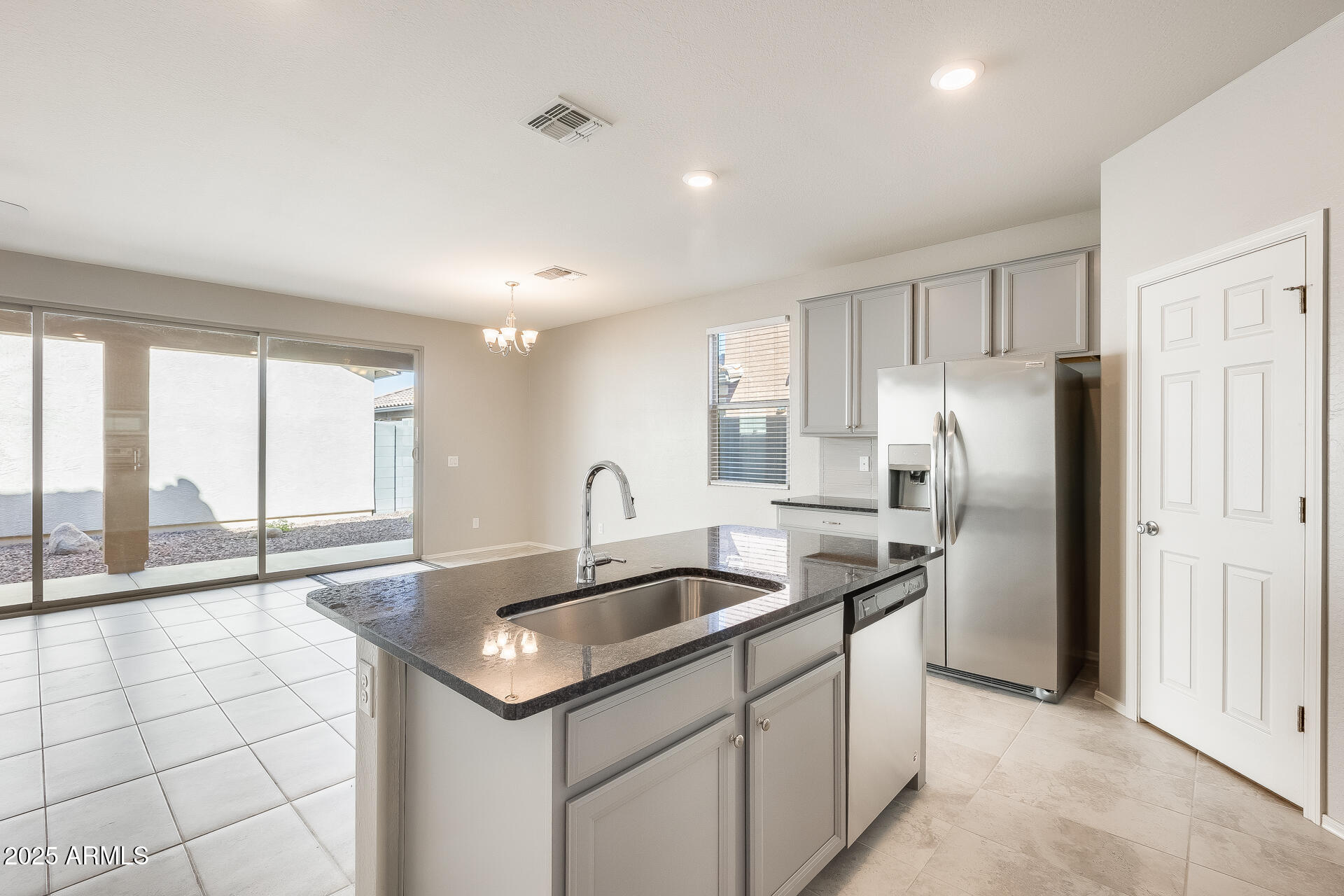 1132 South Amulet Mesa, AZ 85208 - Photo 2 of 37 a kitchen with stainless steel appliances granite countertop a sink and a refrigerator