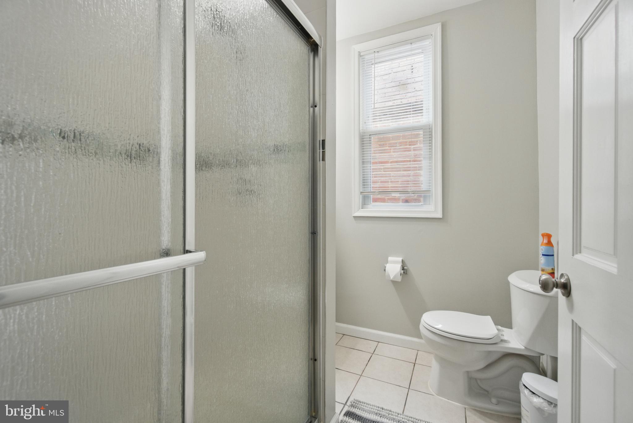 28 T Street Northwest, Unit 3 Washington, DC 20001 - Photo 16 of 34 a white toilet sitting next to a bathroom sink